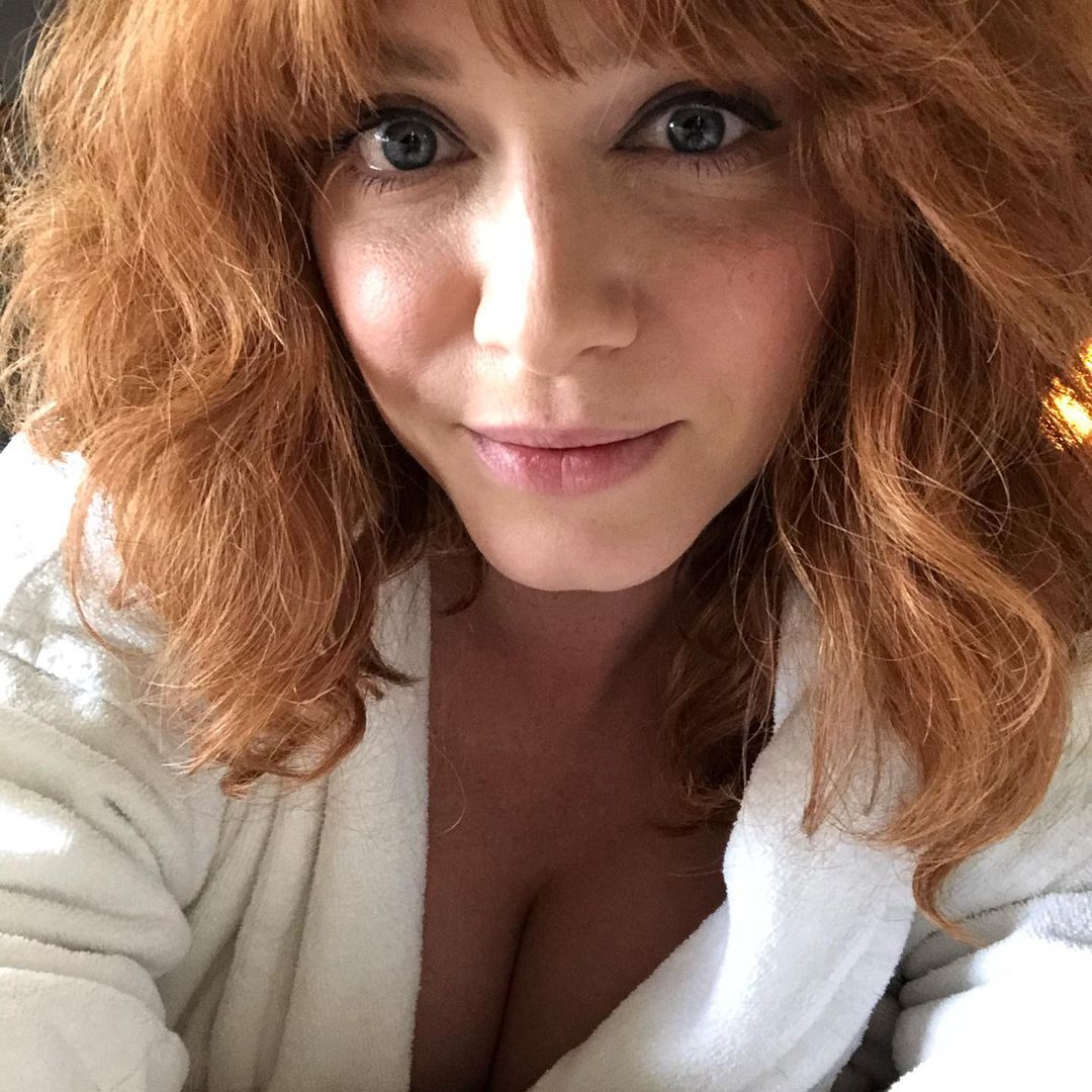 Mommy Christina in a white bathrobe, leaning over you and looking deep into your eyes.