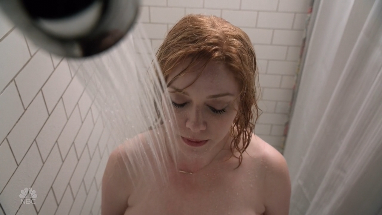 Mommy Christina naked, standing under a running shower head with her eyes closed.